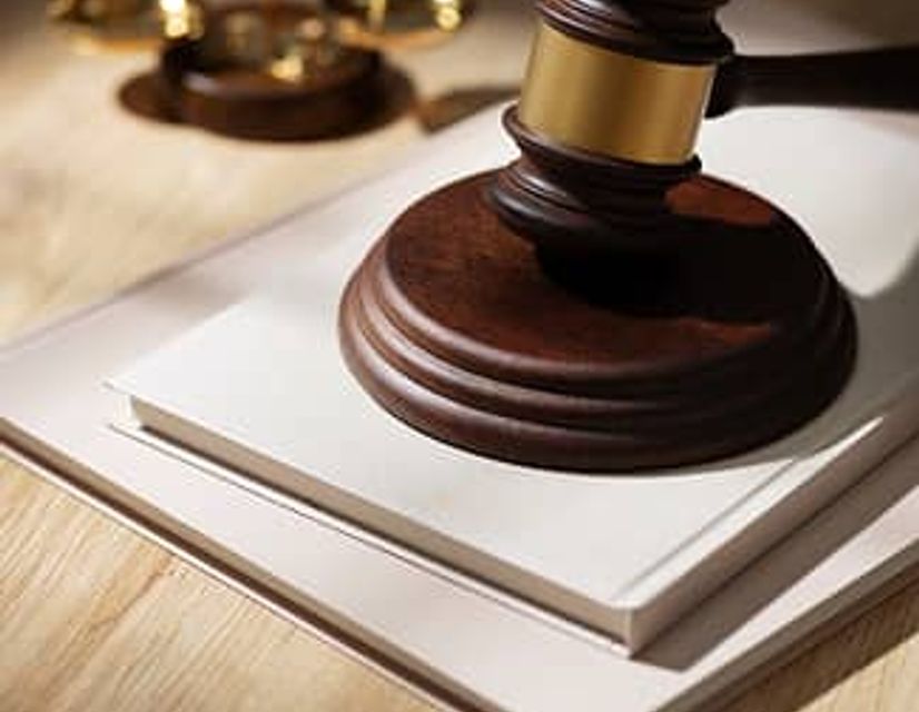 Wooden gavel on dark surface