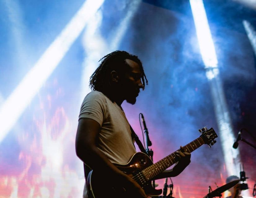 O-1 visa artist playing guitar